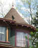 Image of turret detail with gargoyle and finial.