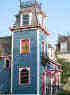 Picture of 22 Sherman:  1870's Empire style in blue and cranberry with mansard-roofed tower