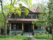 Picture of 56 Kenyon:  teal shingled Victorian with brown and ocher trim