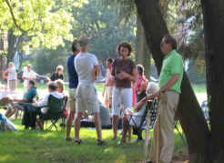 Friends chatting under the trees.