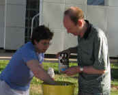 Carol and Dave reaching for the ice cream