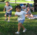 Little boy and girl running to the ice cream