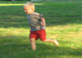 Little one running on the lawn