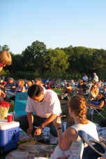 Late afternon summer sun glancing off the crowd