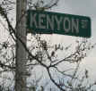 Picture of street sign in trees: "Kenyon St."