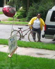 Woman posing with bargin of a bike.