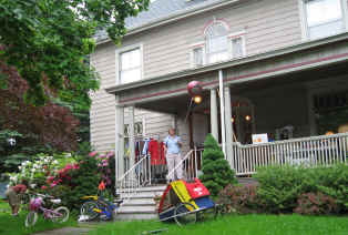 A seller waits on her porch - ready for customers
