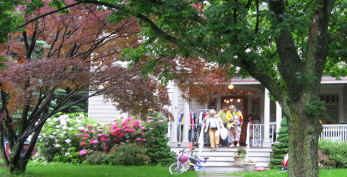 Shoppers step off the porch with their treasures