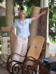 Picture of neighbor selling rugs and rockers off her porch