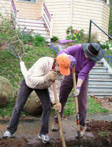 Two women put their backs into it