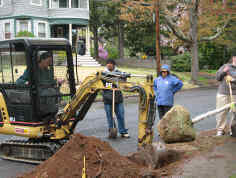 Ron digging a hole with the catepillar