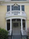 Image of round Victorian porch with Ionic columns repeated above.